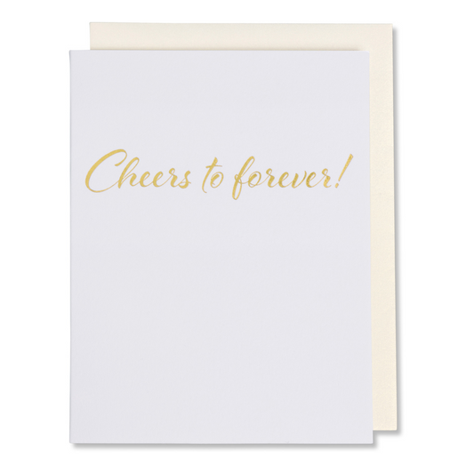 Wedding and anniversary card with gold foil on white paper, reads 'Cheers to Forever,' shown with matching envelope