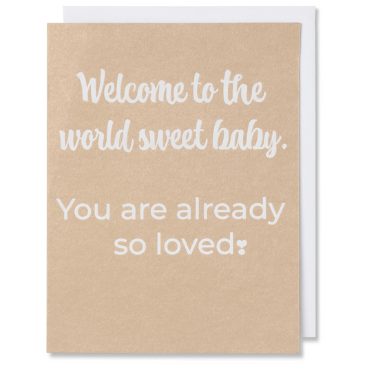 Baby card with white foil on tan paper, reads 'Welcome to the world sweet baby. You are already so loved,' shown with white envelope