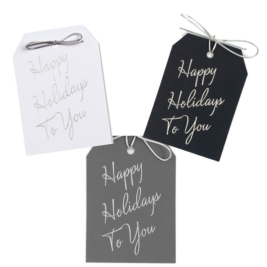 Happy Holidays To You gift tags on thick white, gray, or black paper. Silver foil stamped with a metallic silver tie.