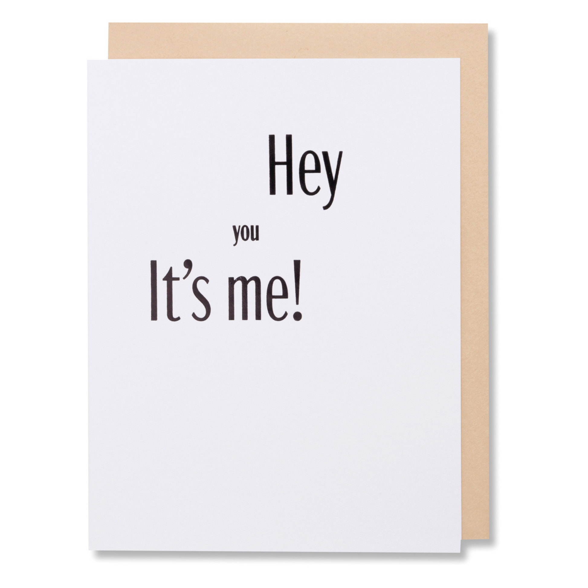 Greeting card with bold black foil text 'Hey You, It’s Me' on white paper, versatile for any occasion, shown with tan envelope