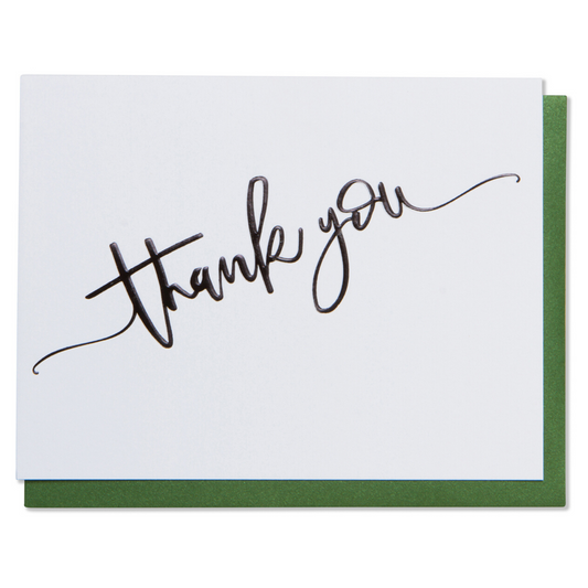 Thank you card. Black foil embossed on bright white paper with a metallic green envelope.