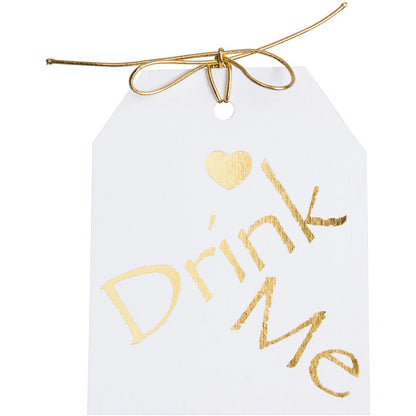 Gold foil on white paper.Drimk Me gift tags with a gold heart above the word Drimk Me. 3.5x4" wirh gold metallic tie